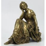 A gilt metal figure, of a seated classical female with lyre, signed Halcros?, height 5.