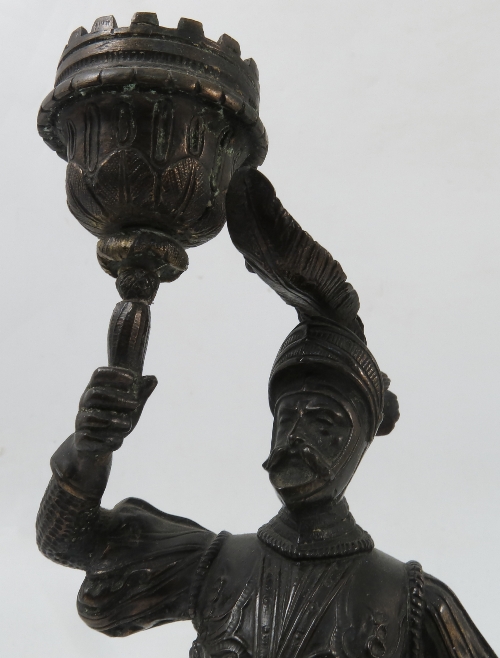 A 19th century bronzed candlestick, formed as a soldier in armour holding the sconce, - Image 3 of 3
