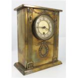 A brass cased mantel clock, the movement stamped REX, with white chapter ring,
