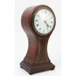 An Edwardian oak cased mantel clock, of balloon form, with white enamel dial,