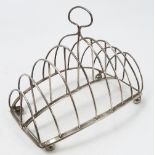 A Georgian silver nine bar toast rack, of curved form, London 1797, maker Peter,