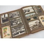 A late 19th/early 20th century postcard album, containing approximately 600 cards,
