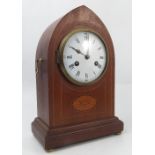 A mahogany cased striking mantel clock, with white enamel dial and Roman numerals,