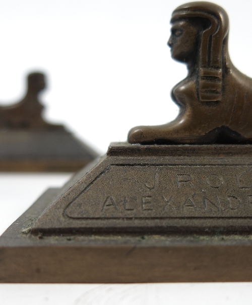 A pair of bronze advertising paperweights, for J Rolo and Company, Cotton Merchants,