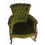 An Edwardian mahogany button back armchair, with showood frame,