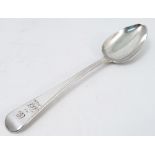 A Georgian silver serving spoon, with engraved initials, London 1813, maker William Eley,