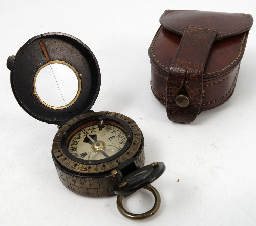 A Negretti & Zambra pocket compass, with lacquered and brass case,