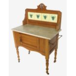 A 19th century pine washstand, having four tiles to the back to a marble top,