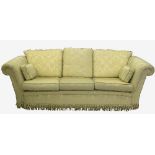 A three piece suite, in damask pale yellow upholstery, comprising a three seat sofa, width 96ins,