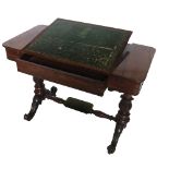 A 19th century rosewood writing table, with rising ratcheted lift up leather writing surface,