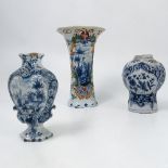 A 19th century tin glazed delft pottery vase, of trumpet form,