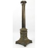 A brass table light, with leaf sconce to a cluster column,
