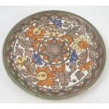 A Crown Ducal Charlotte Rhead charger, with tube lined decoration of a band of leaves,