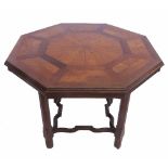 A Howard and Sons oak octagonal top centre table, with parquetry fan and rectangular inlay,