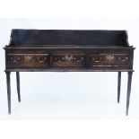 A 19th century oak three drawer dresser base, with a shelf superstructure over,
