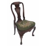 An 18th century walnut single chair, with shaped central splat,