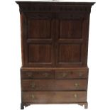 An Antique oak press cupboard, with twin fielded panelled doors,