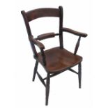 A low 19th century Windsor bar back dining armchair