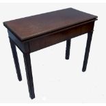 A Georgian mahogany foldover tea table, of rectangular form, with chamfered moulded legs,