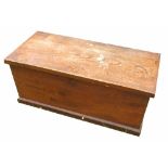 An Antique elm box, the interior fitted with a candle box, raised on a plinth base,