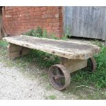 An Antique pig bench trolley,