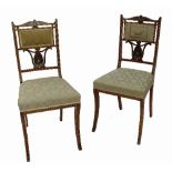 A pair of 19th century rosewood chairs, inlaid with white metal,