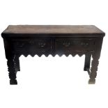 A dresser base, fitted two frieze drawers above the arched frieze, with similar front legs,