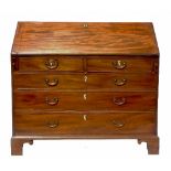 A 19th century mahogany bureau, the interior with central cupboard, secretaire compartment,