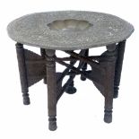 A brass topped Benares table,