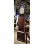 An antique long case clock, with painted arched dial, date aperture,