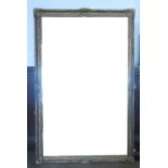 A large gilt framed wall mirror, the frame with leaf and scroll decoration,