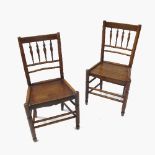 A harlequin set of eight Clissett chairs, with solid seats and spindle backs,