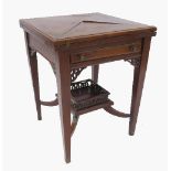 An Edwardian mahogany envelope table,