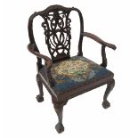 An 18th century style mahogany armchair, with interlaced ribbon back, harebells, swags and ribbons,