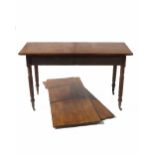 A mahogany dining table, with gate leg action, having three square leaves,