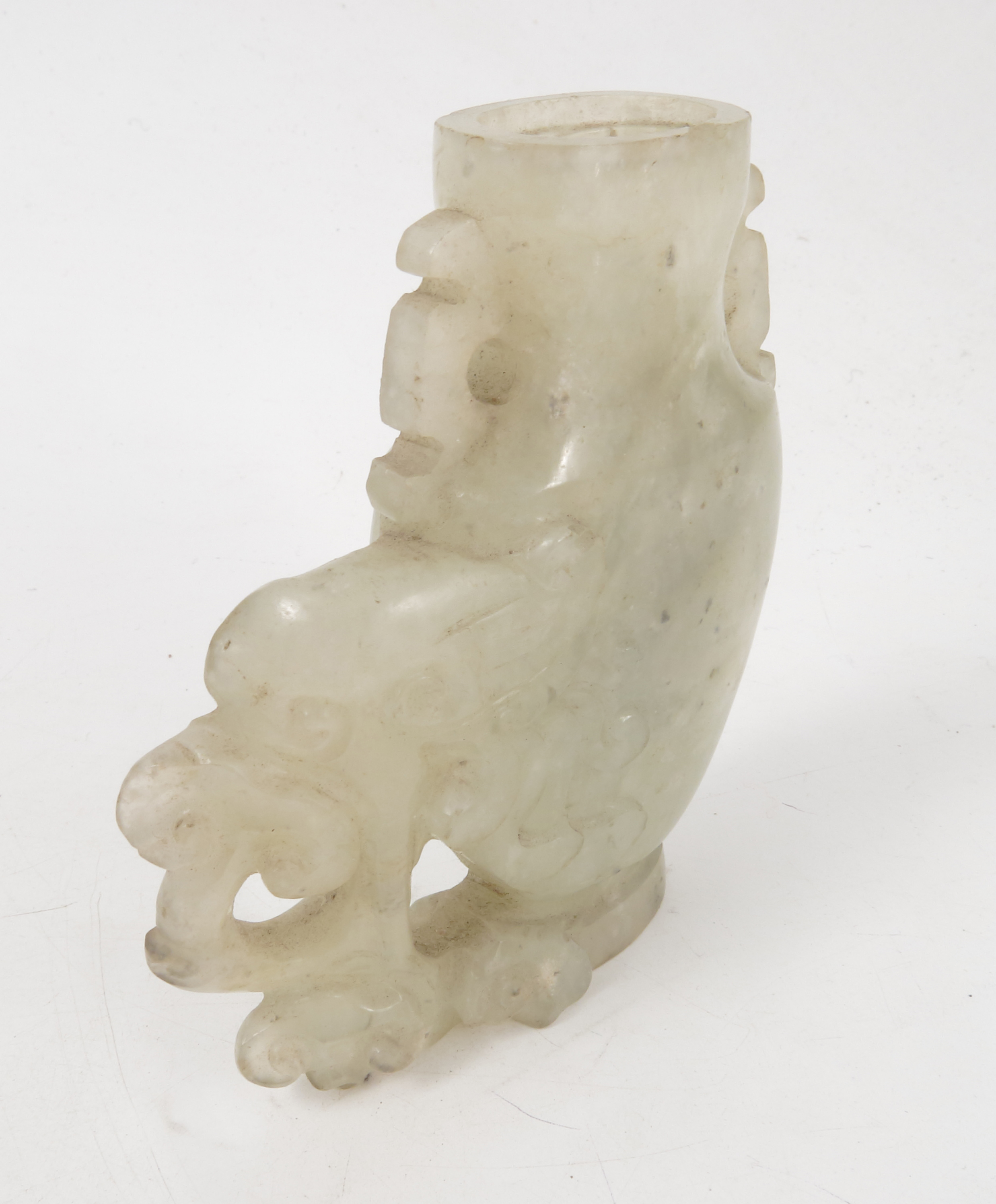 A carved hardstone vase, possibly white jade, of a stylized elephant and foliage, height 3. - Image 3 of 4