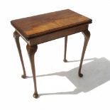 A reproduction card table, with quarter veneered top,