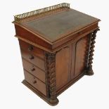 A 19th century mahogany Davenport, with brass gallery and hinged pen tray over,