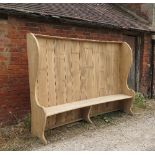 A similar large elm settle, with curved back,