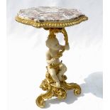 An 18th century style centre table, the shaped marble top raised on putti supports holding scrolls,