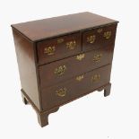 An Antique mahogany and walnut veneered chest of drawers,