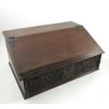 An 18th century bible box with sloped rising front,