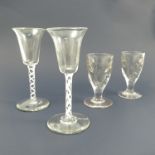 Two similar air twist cordial glasses, one having a single air twist column,