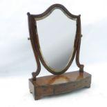 A 19th century swing frame toilet mirror, the shield frame raised on a bow front base,