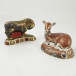 Two Royal Crown Derby paperweights, modelled as a bull and a recumbent deer, dated 1995 and 1994,