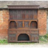 A 19th century oak dog kennel dresser, with associated panel back,