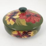 A Moorcroft pottery covered bowl, decorated in the Hibiscus pattern,