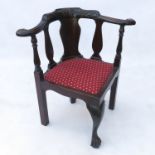 A 19th century carved mahogany corner chair, with splat back,