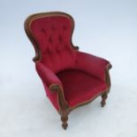A mid 19th century mahogany show wood grandfather's chair raised on turned legs