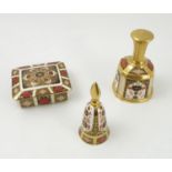 A Royal Crown Derby cigarette box together with two table bells,